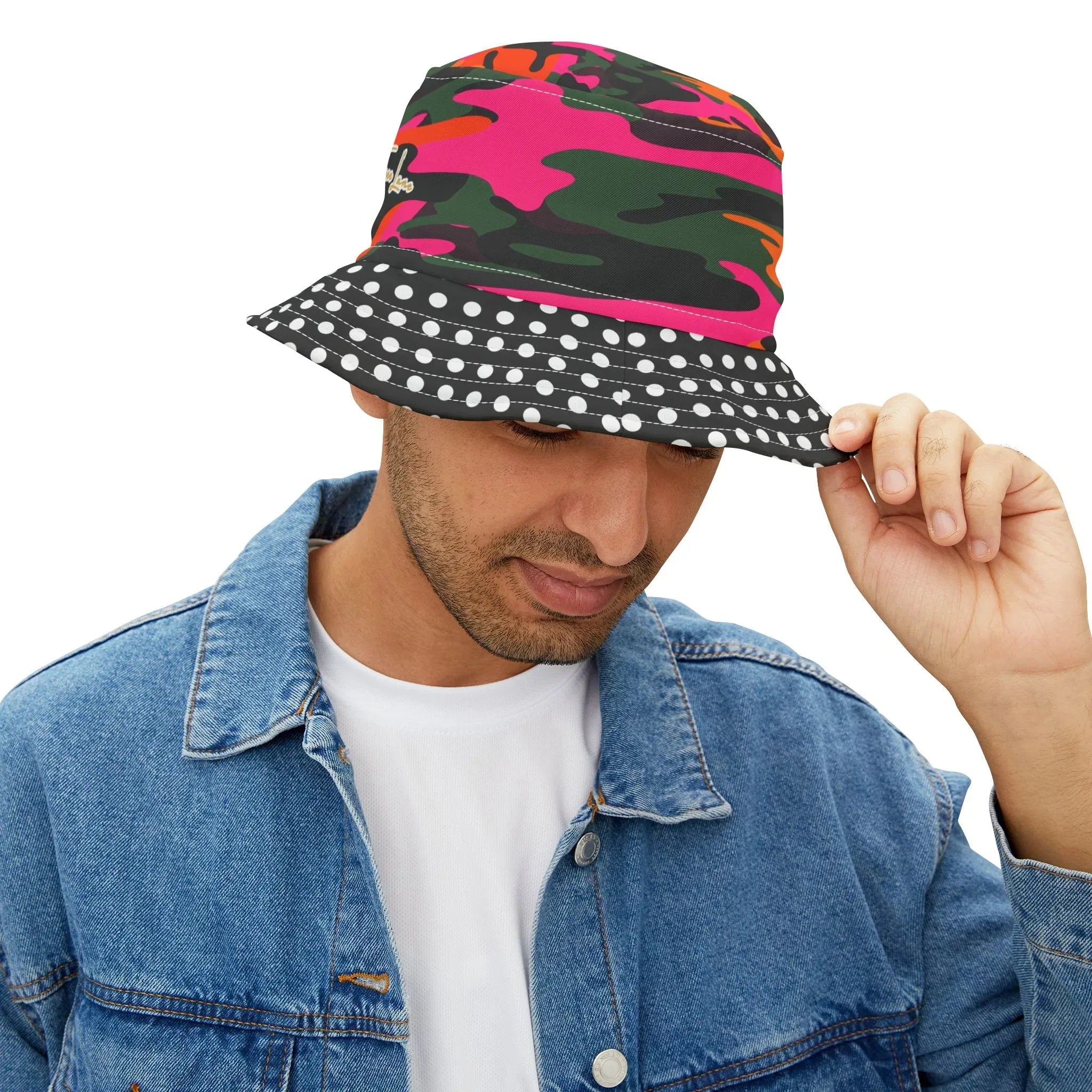 Person wearing a colorful pink, green and orange camouflage bucket hat with a polka dot brim on a white background