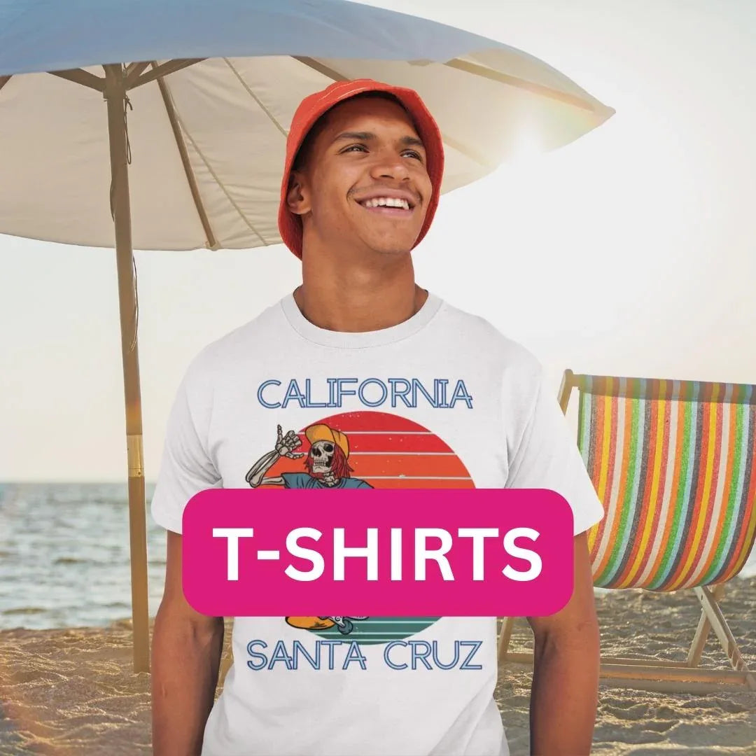 Graphic California Santa Cruz T-shirt with bold beach design worn outdoors in sunny coastal setting.