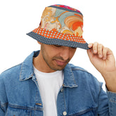 Man wearing a colorful bucket hat with a vintage paisley patterned design on a white background