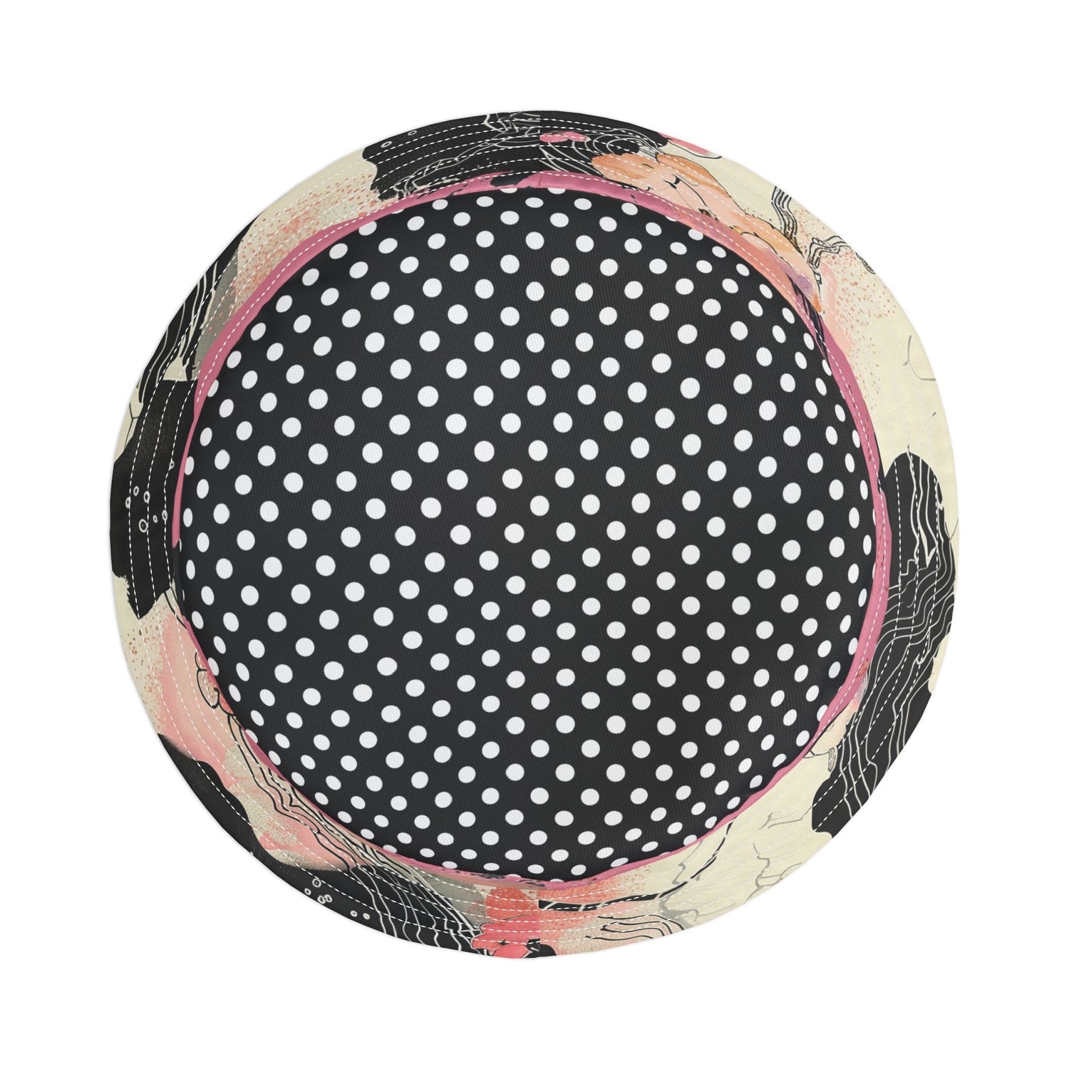 Top view of a round black and white polka dot bucket hat with Asian floral brim on a white background