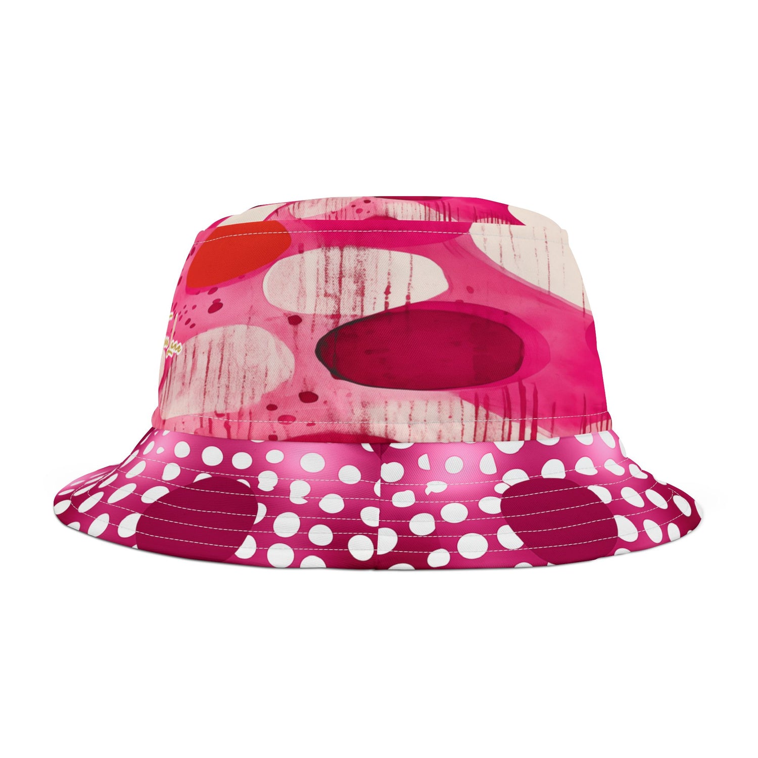 Pink bucket hat with white polka dots and red abstract design on a white background