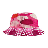 Pink bucket hat with white polka dots and red abstract design on a white background