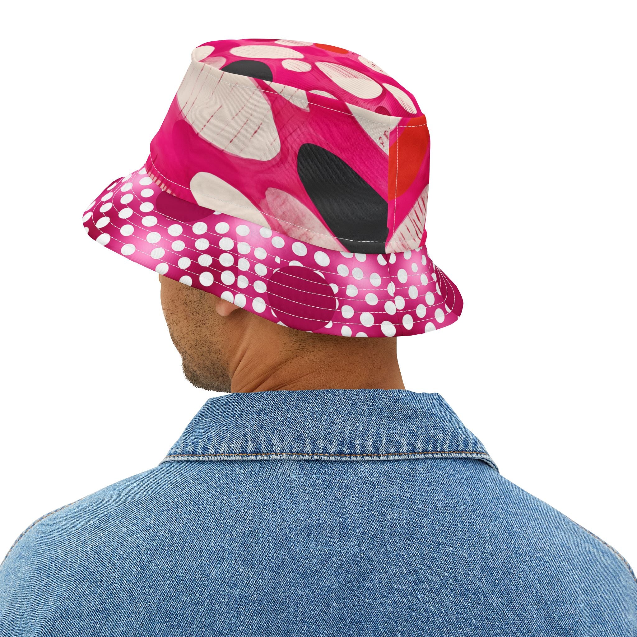 Person wearing a pink and white polka dot bucket hat and showing the back view on a white background
