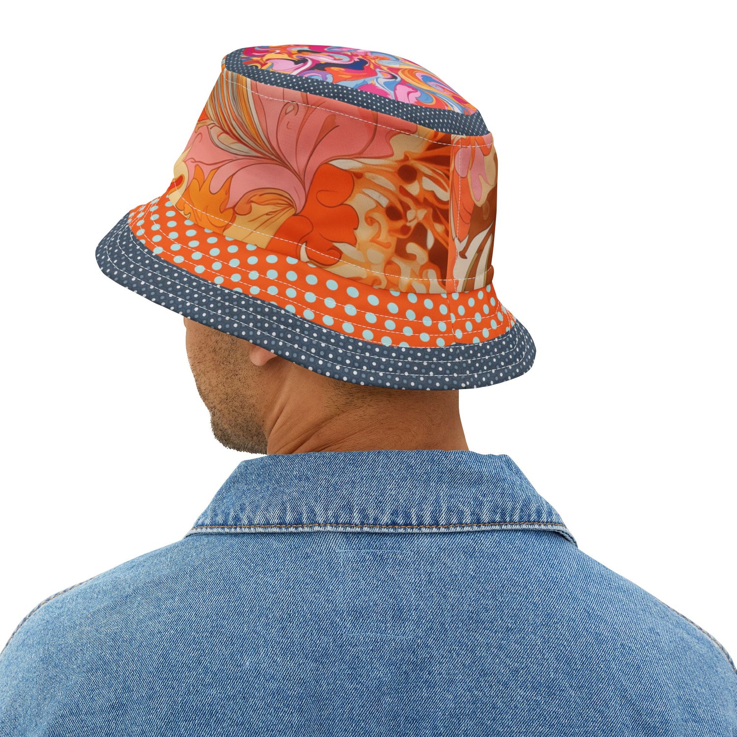 Person wearing a colorful bucket hat with floral design on a white background