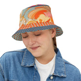 Woman wearing a colorful vintage paisley bucket hat with a white background