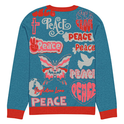 Back side of a blue sweater with peace-themed designs on a white background