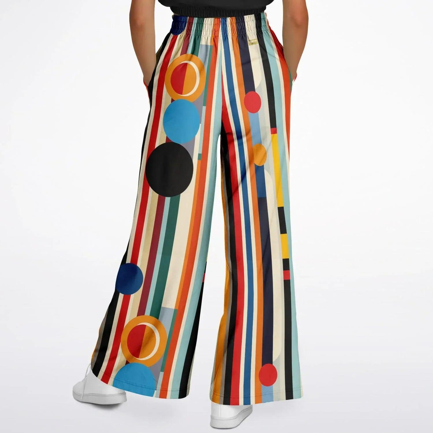 Back view of More Cowbell Wide Leg Pants with colorful stripes, geometric circle print, and drawstring elastic waist