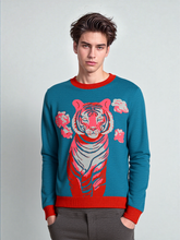 Man wearing a blue sweater with a red tiger design on a gray background