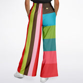 Colorful striped pants worn by a person on a white background