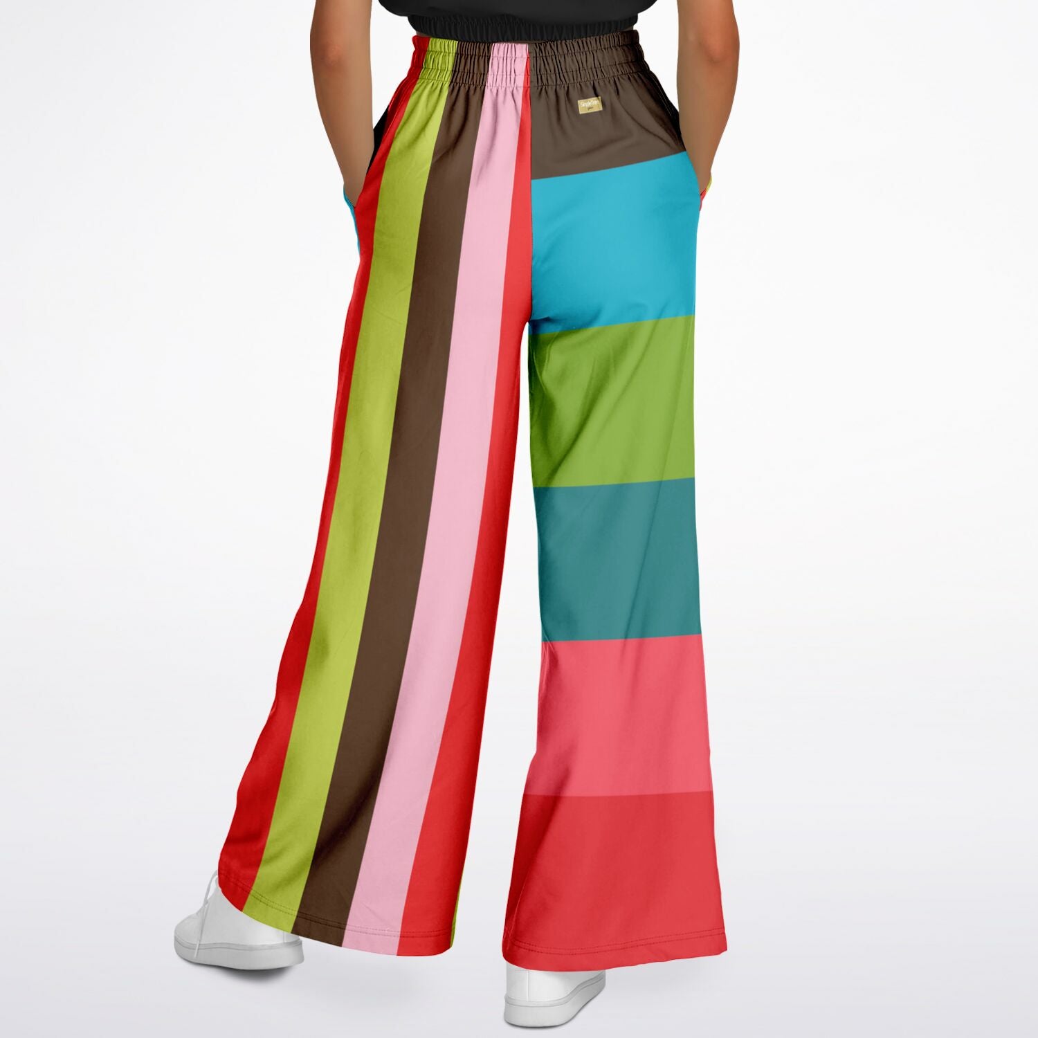 Colorful striped pants worn by a person on a white background